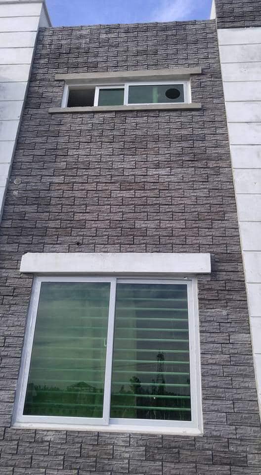 Black outdoor front wall house face stone tiles design in pakistan